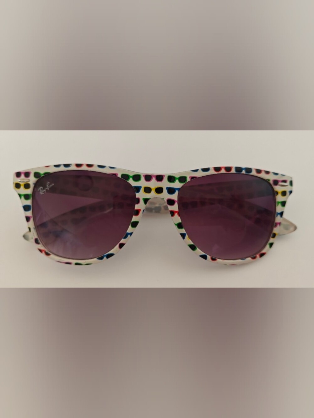 Ray-Ban Wayfarer Special Series #4 white frame covered in colorful sunglasses